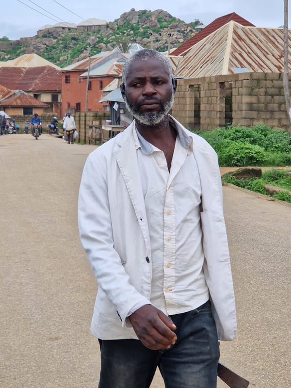 Street life and social graphics from a Jos morning