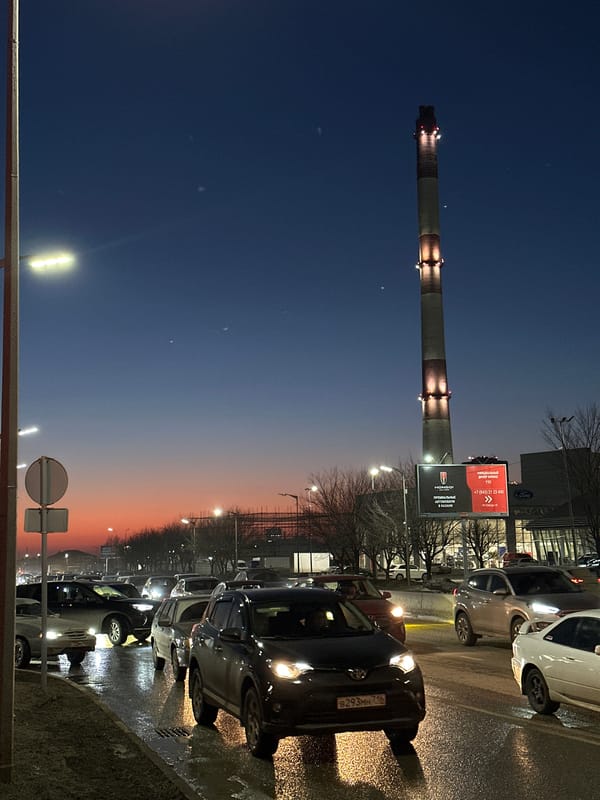 Industrial chimney dominates Kazan skyline at dusk