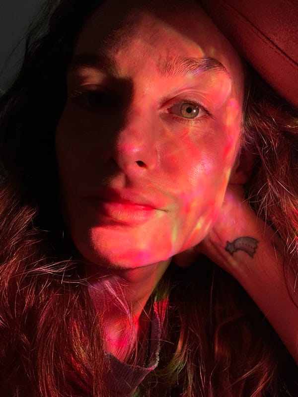 Person filmed with colored lighting effects in Kiel portrait session