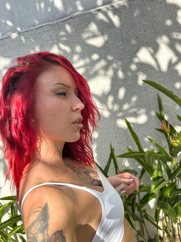 Woman rests outdoors in shaded area in North Kuta