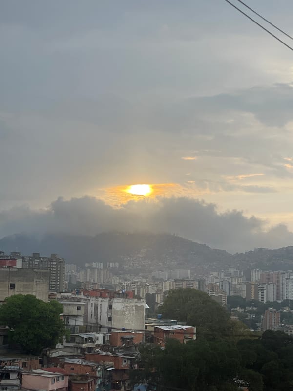 Caracas cityscape documented under cloudy evening skies