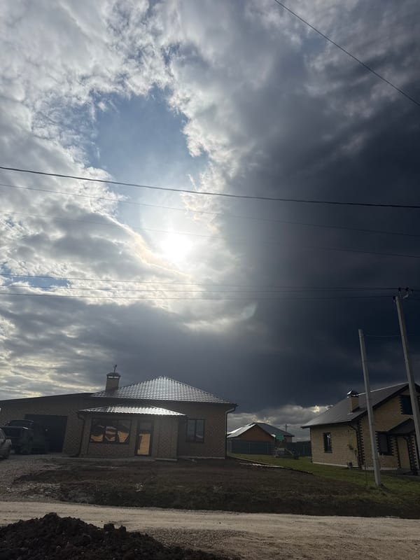 Woman photographed against stormy sky in rural Russia