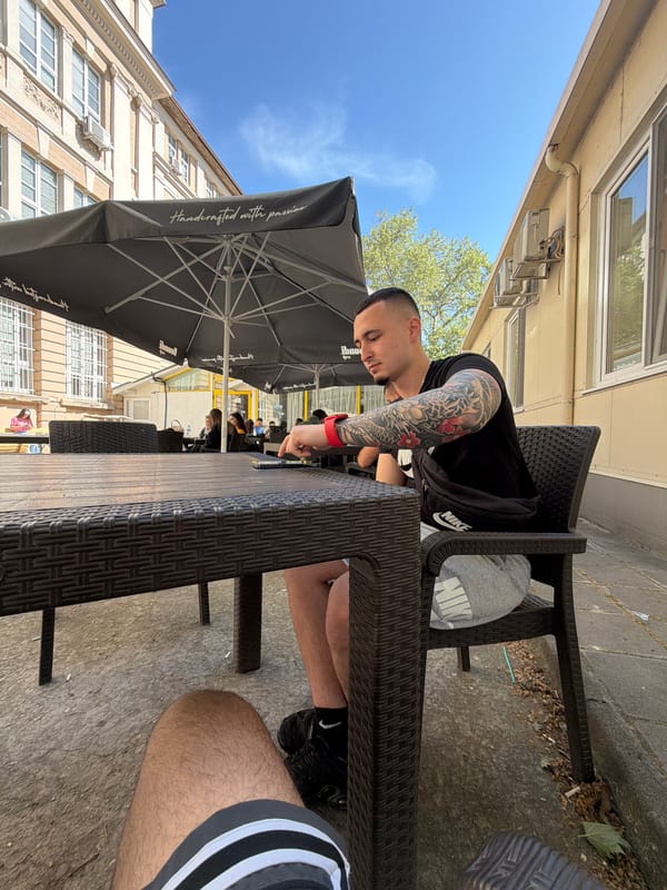 Two men enjoy morning coffee at Plovdiv cafe