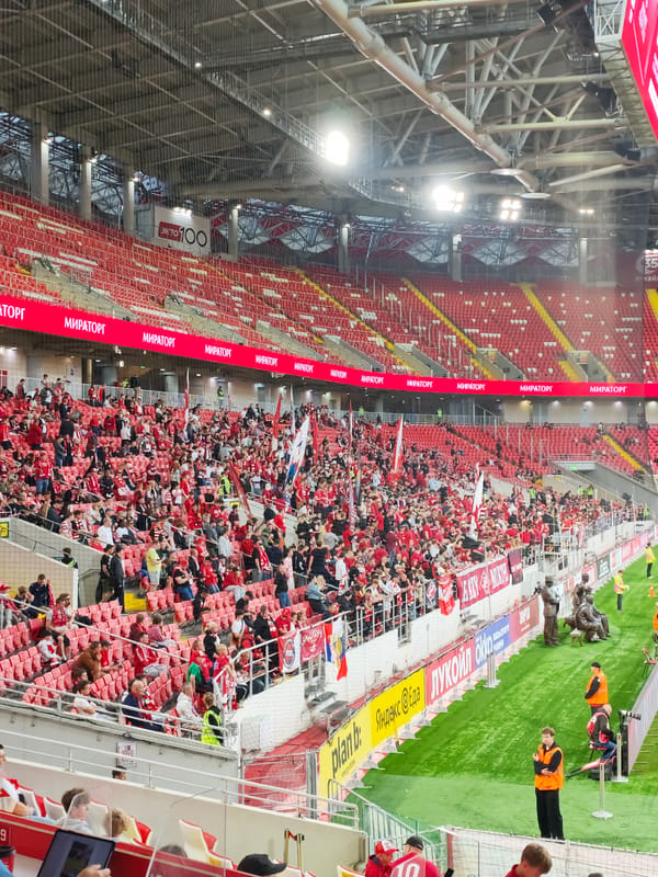 Packed stadium and team transport logistics at a soccer event