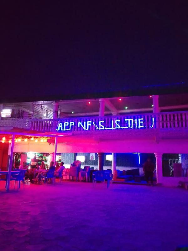 Nighttime dining scene captured at illuminated Sabon Tasha establishment