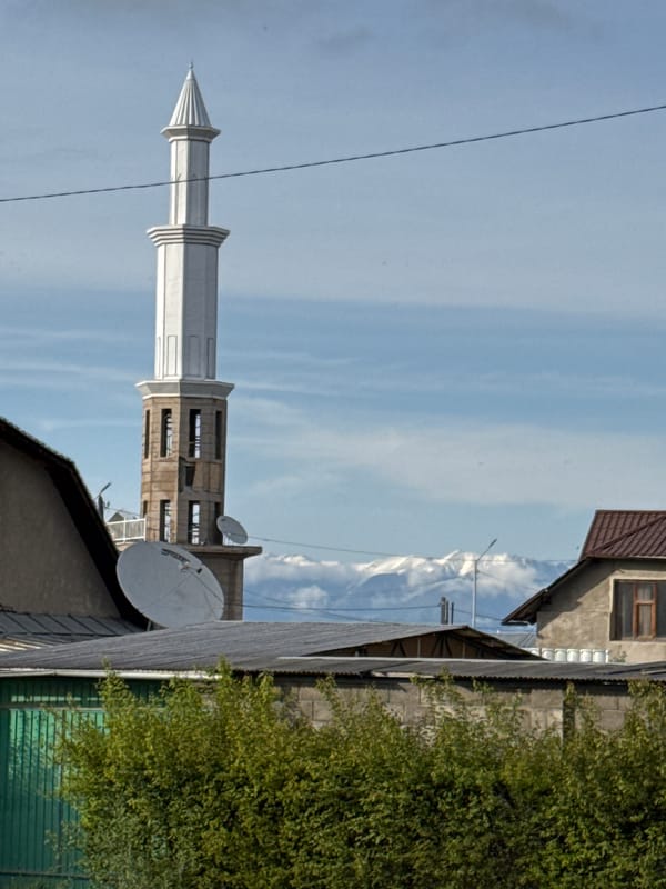 Street scenes documented across Karakol City, Kyrgyzstan during midday