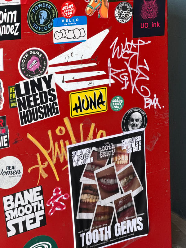 Sticker-covered public surfaces documented across Whistler