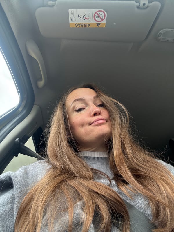 Woman photographed inside vehicle in Povarёnki, Russia