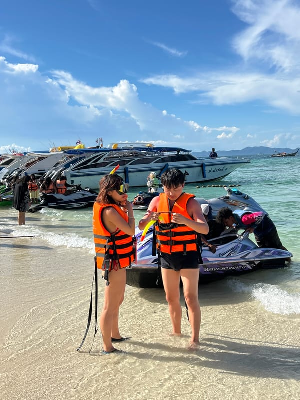 Families enjoy morning beach activities at Thai resort destination