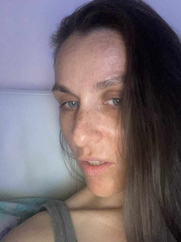 Relaxing at home with a blanket and TV remote