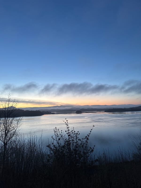 Dawn landscape with colorful sky transition observed in Norway