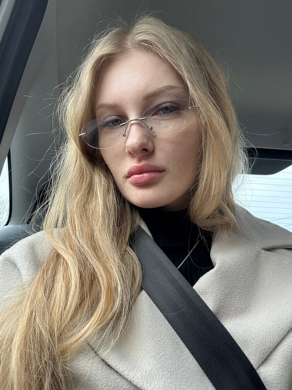 Woman photographed in car during early morning in Perm