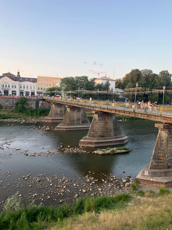 Sunset walk along Uzhhorod's Uzh River embankment and bridge
