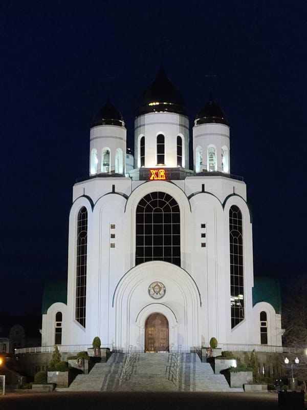 Evening scenes documented across Kaliningrad including cathedral, square, barbershop
