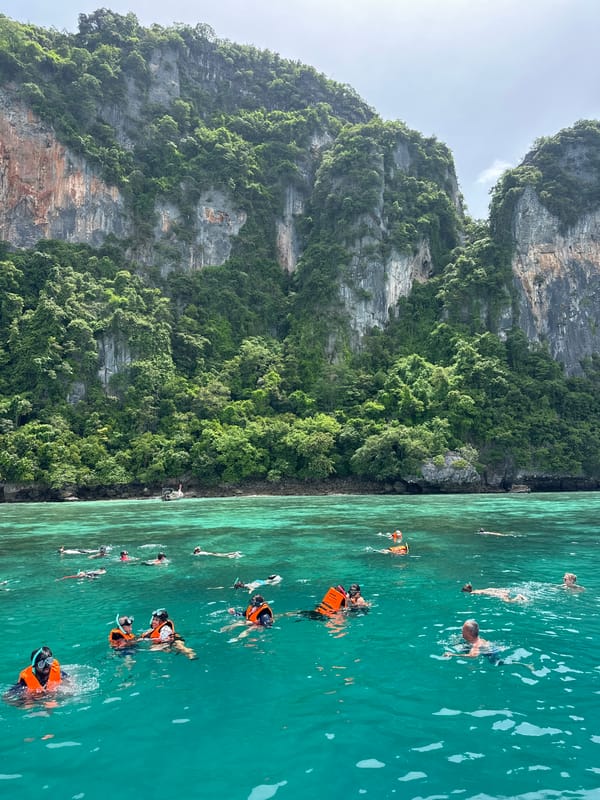 Boats and snorkelers among Ao Nang's limestone islands