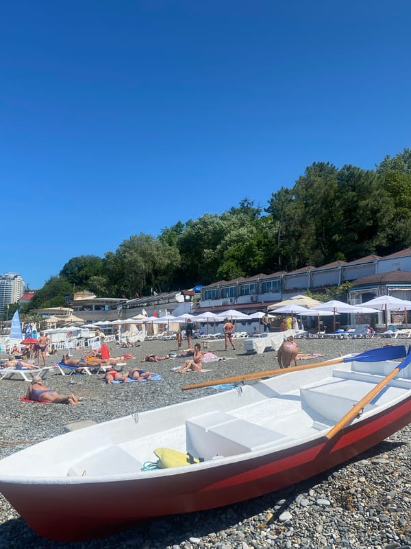 Summer morning on the Sochi waterfront, beach life underway