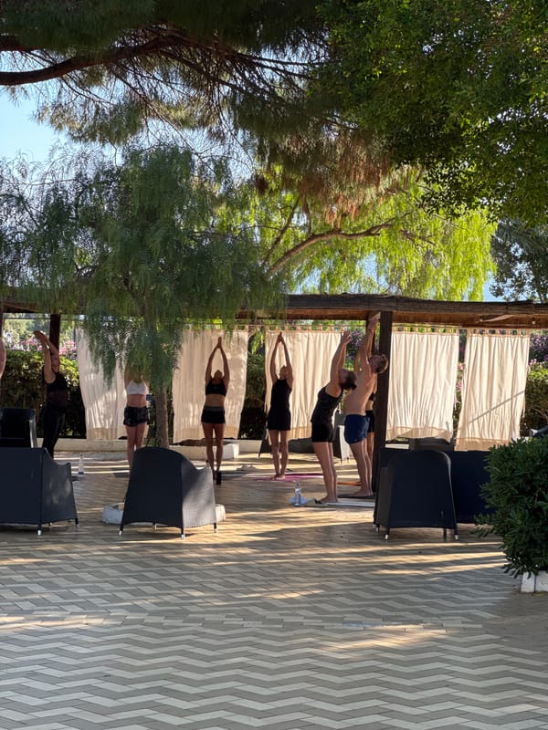 Yoga, stage programming, and poolside evening at Isola delle Femmine resort
