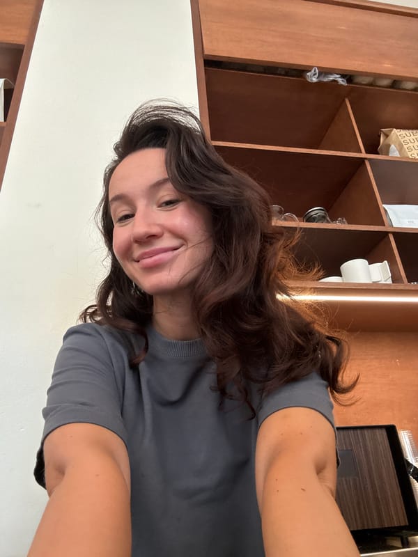 Casual indoor portrait in front of a wooden shelf, Tel Aviv