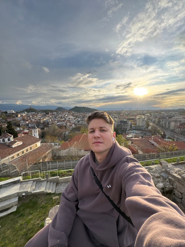 Tourist takes sunset selfies at ancient Plovdiv overlook