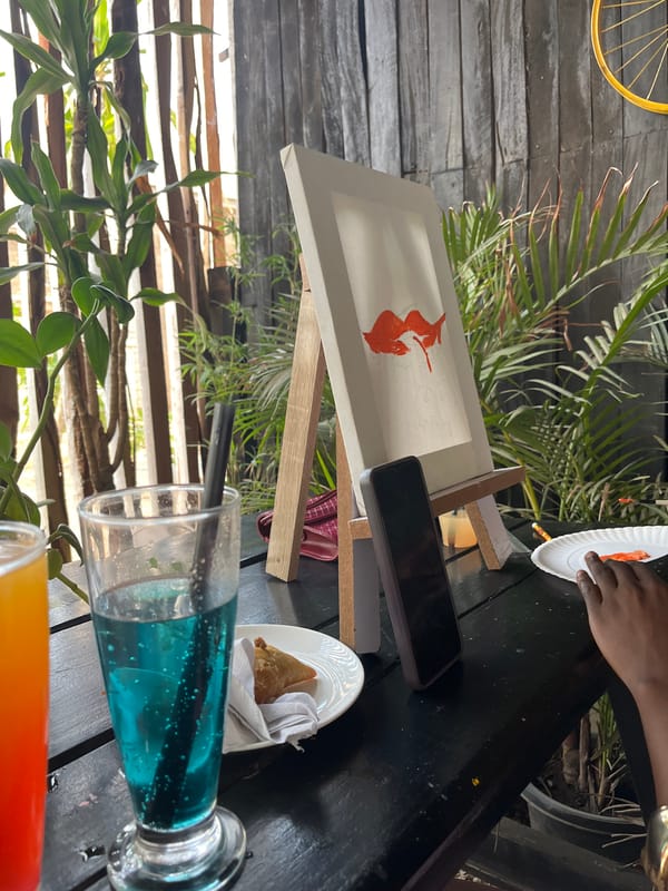 Artist paints cocktail scene outdoors in Jos, Nigeria