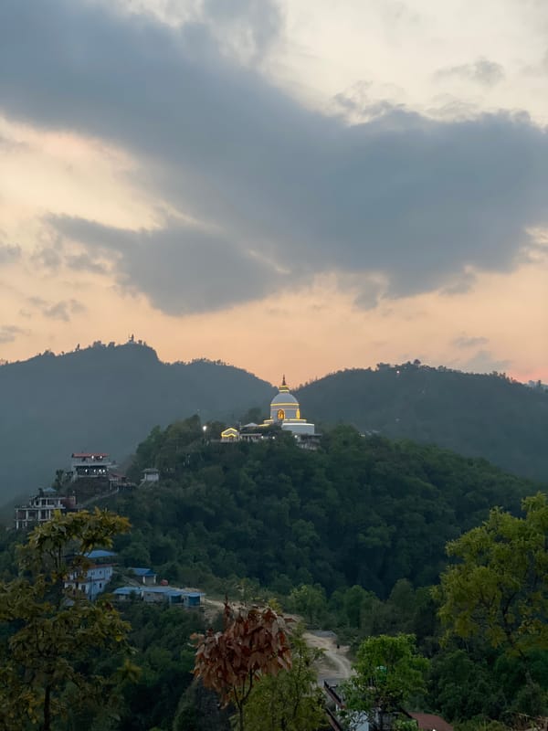 Religious stupa observed on hilltop overlooking Pokhara, Nepal