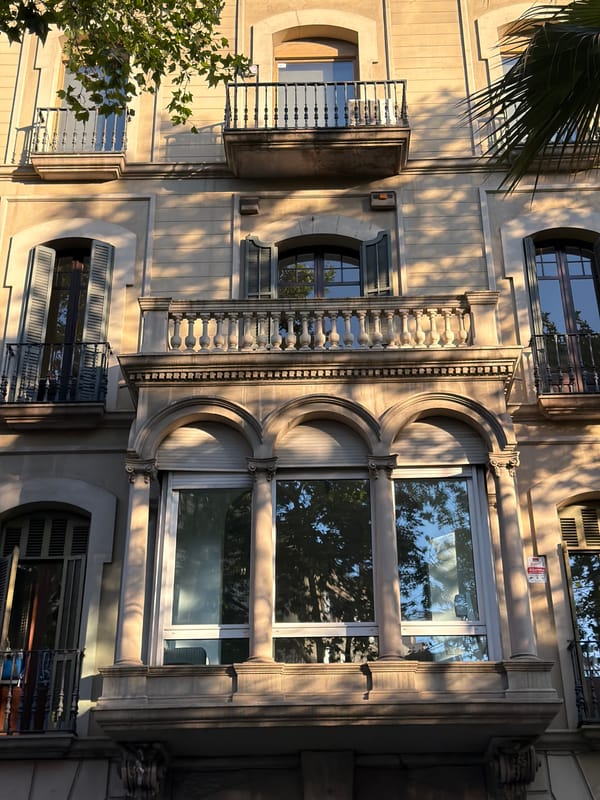 Barcelona's ornate building facades in warm evening light