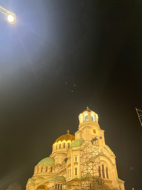 Sofia at night: cathedral lights and a neon welcome sign