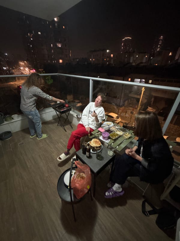 Evening balcony barbecue gathering documented in Bat Yam, Israel