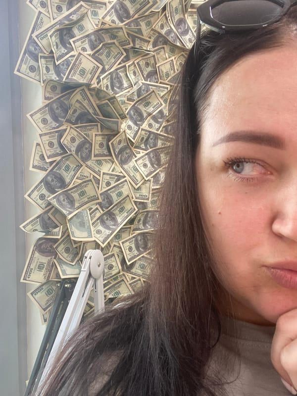 Woman poses with hundred-dollar bills in Sochi nail salon