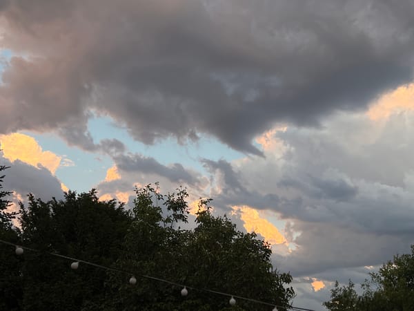 Dramatic sunset clouds photographed from a suburban neighborhood