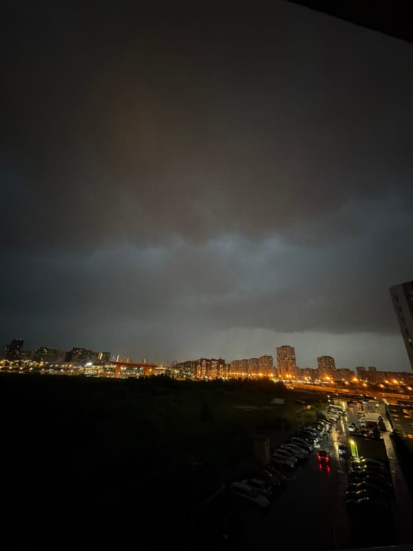 Stormy Yekaterinburg night sky, lightning and a quiet moment indoors