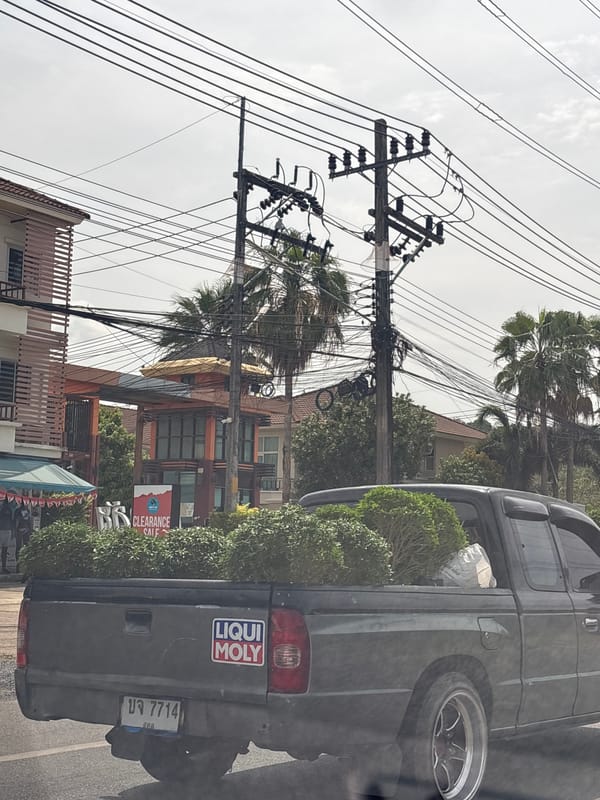 Street scene captured in Si Sunthon showing electrical infrastructure