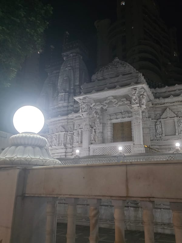 Mumbai's Akshardham Temple and neighboring residential towers at night