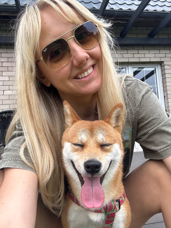 Woman enjoys morning with pets in Carnikava, Latvia