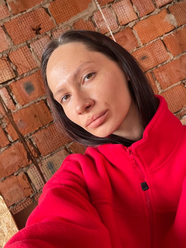Photo session at decorated brick building in Oktyabr'skii