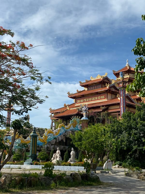 Morning at a Da Nang Buddhist temple complex with lotus ponds