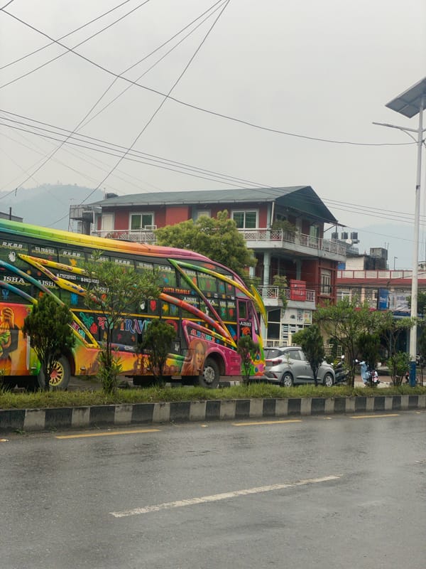 Colorful buses spotted on wet Pokhara streets after rain