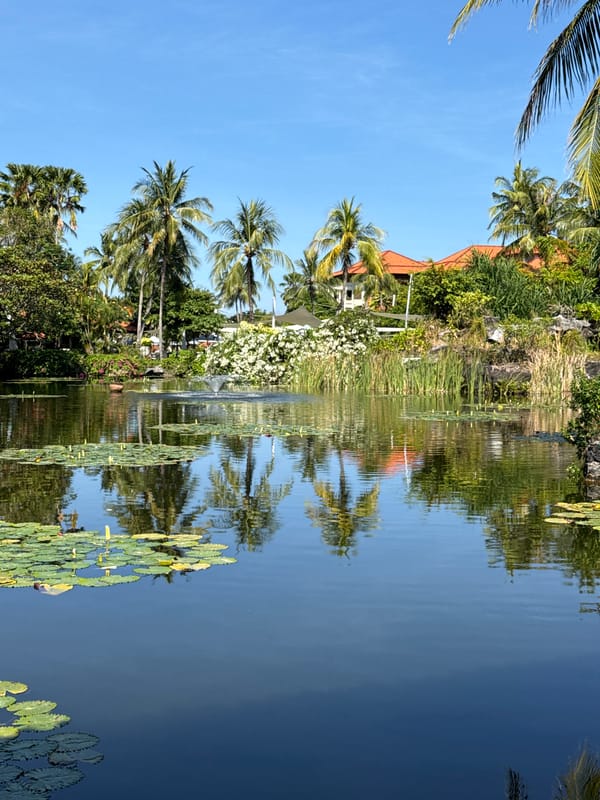 Tourist documents tropical resort grounds in Kuta Selatan, Indonesia