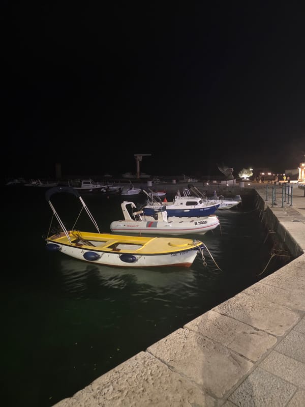 Nighttime harbor town scenes with cannons, boats, and a passing storm