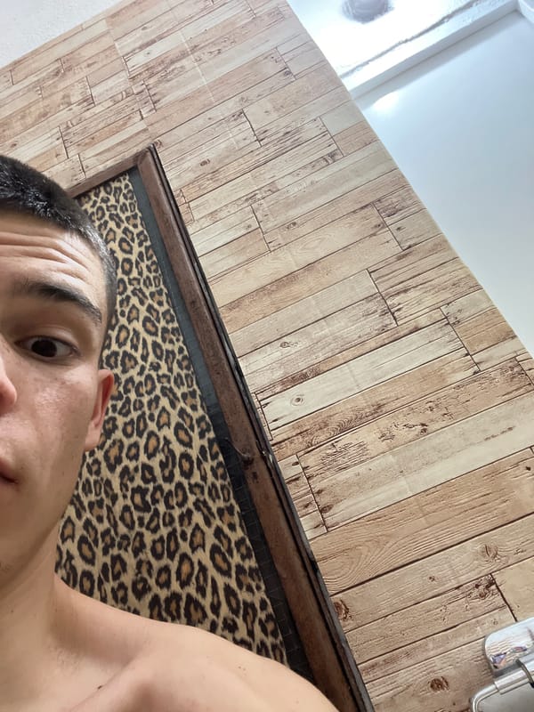 Portrait captured against leopard-print headboard in Sopot, Bulgaria