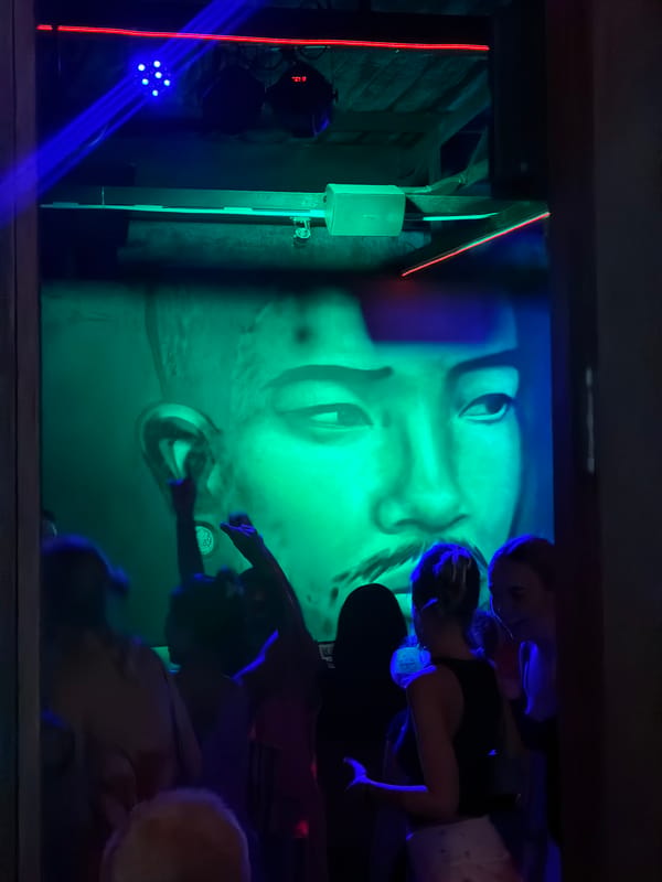 Illuminated face art installation draws patrons at Phuket nightclub