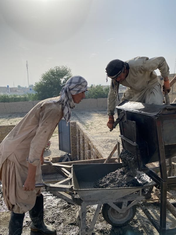 Construction work continues at Kandahar building site under clear skies