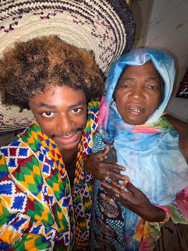 Two people share smiling moment indoors in Igboefon, Nigeria