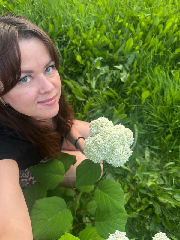 Cutting garden flowers on a summer afternoon in Chaikovsky