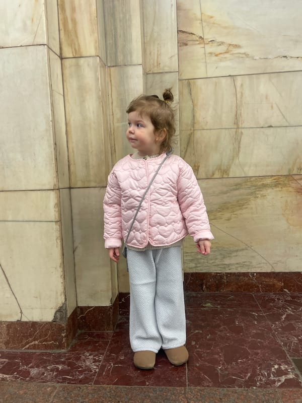 Child visits Lenin's Mausoleum in Moscow during morning hours