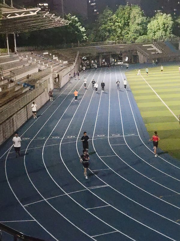 Night runners use athletic track in Shapingba District