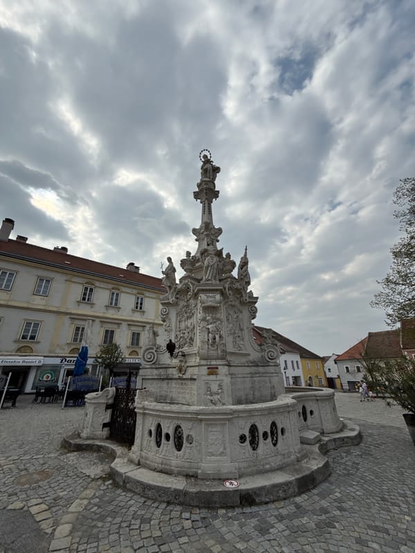Tourist documents historic Austrian town's architecture and streets