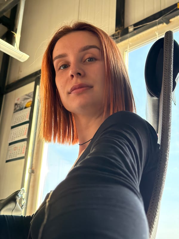 Woman takes selfies in winter dawn in Chaikovsky