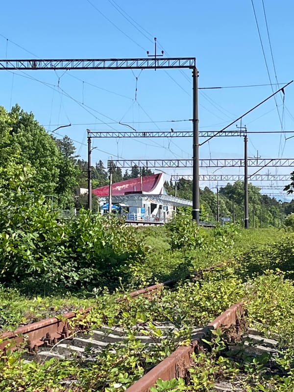 Ureki street life: railway tracks, trucks, and roadside scenes