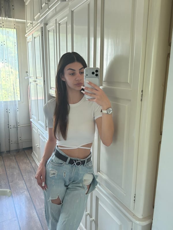 Woman Takes Morning Mirror Selfie in Gabrovo, Bulgaria